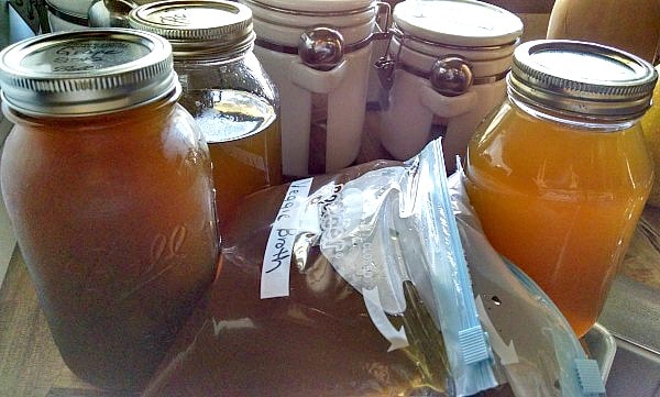 homemade veggie broth stored in mason jars