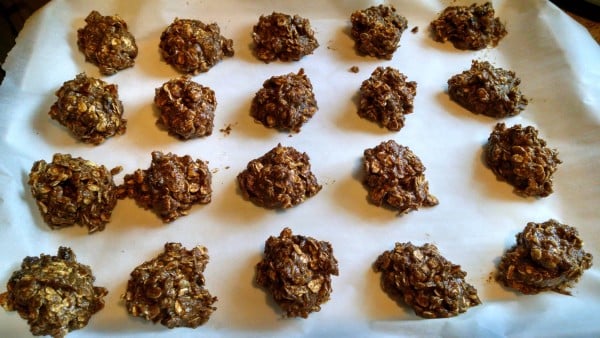 vegan oatmeal raisin cookies on parchment paper