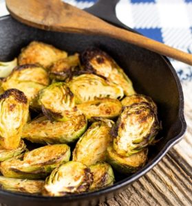 brussels sprouts slice in half in cast iron pan