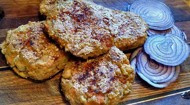 chickpea burgers on wood with onions