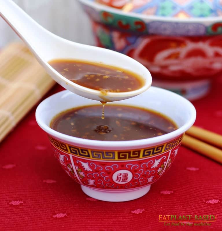 stir fry sauce with drip in bowl