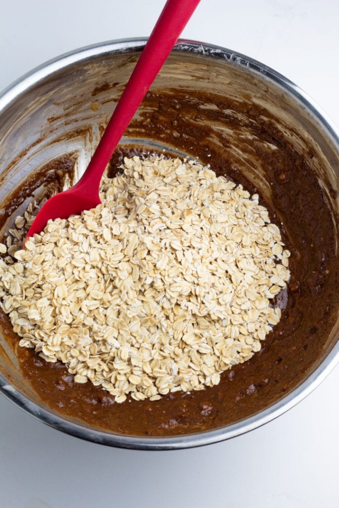 oats in chocolate batter for cookies in large bowl