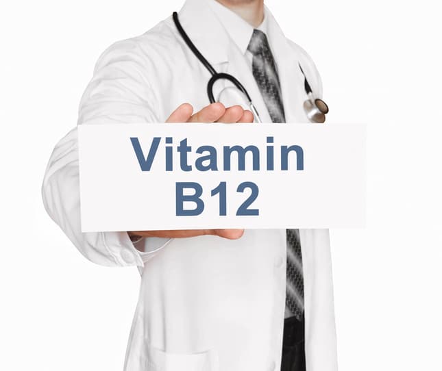 b12 supplements for vegans . doctor holding card.