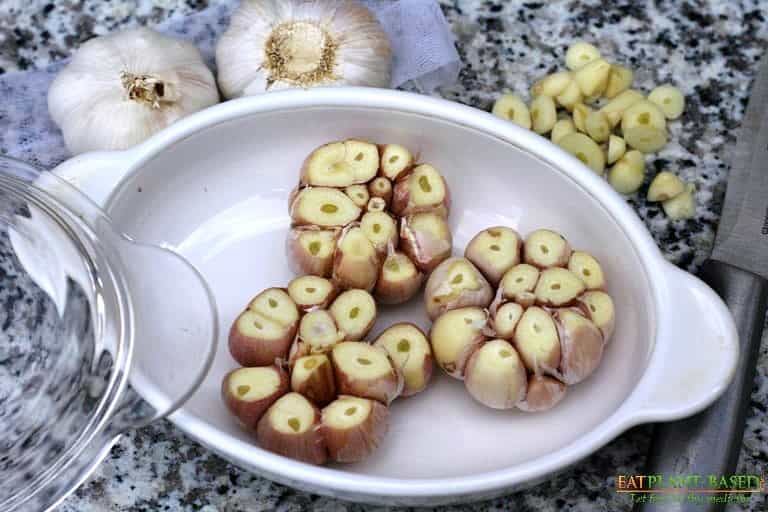 cloves of garlic in pan