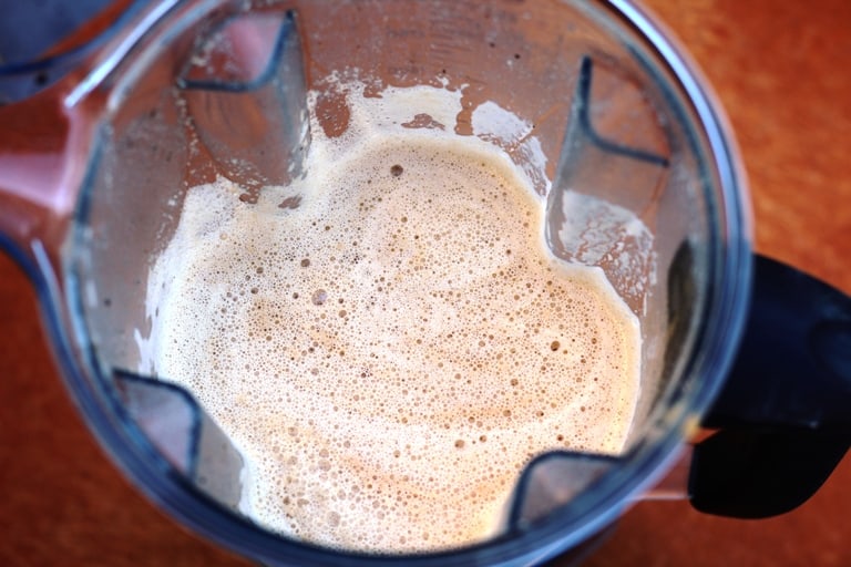soy sauce, tahini, garlic, and spices in blender. 