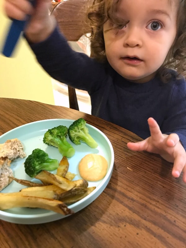baby eating vegan at a table