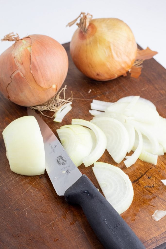 onions being diced on cutting board