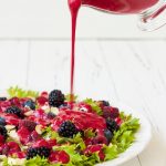 Summer refreshing mixed berry salad with pumpkin seeds, blue cheese, feta and sweet red raspberry vinaigrette