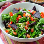 white bowl filled with mexican kale salad