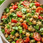 quinoa chickpea salad with miso dressing in a large serving bowl.