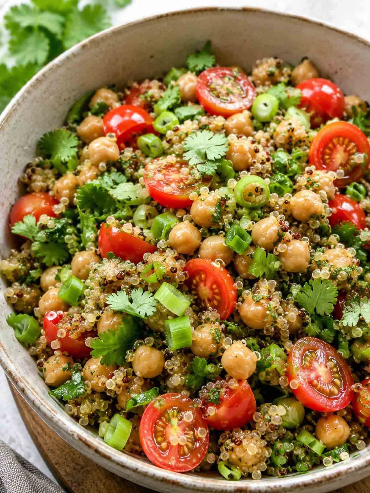 quinoa chickpea salad with miso dressing in a large serving bowl.