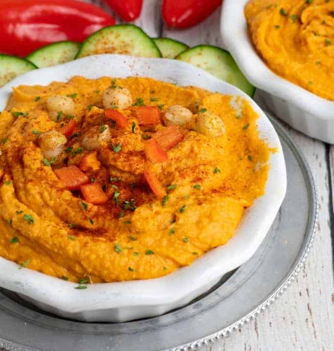 red pepper hummus in white bowl