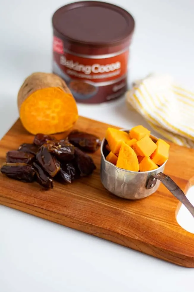 ingredients for sugar free chocolate icing on counter sweet potatoes dates