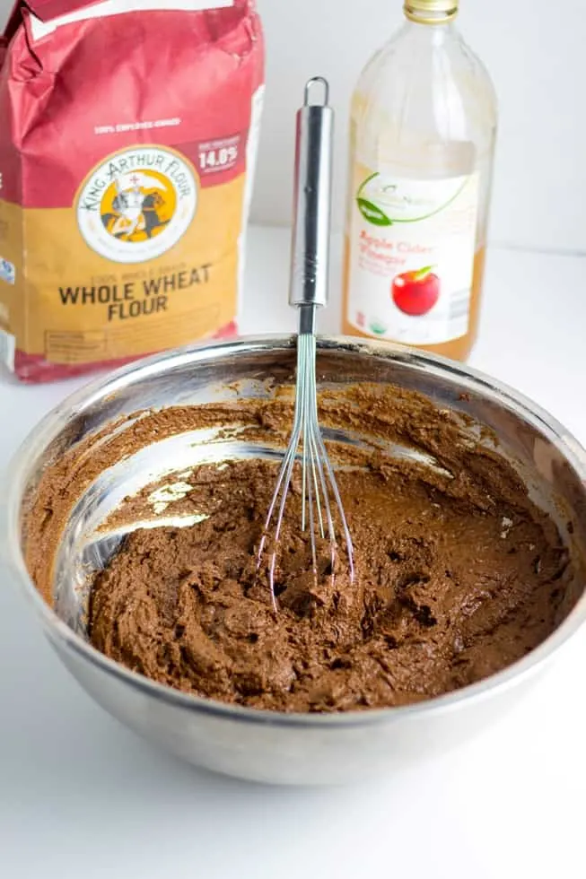 sugar free chocolate cake batter in bowl with whisk
