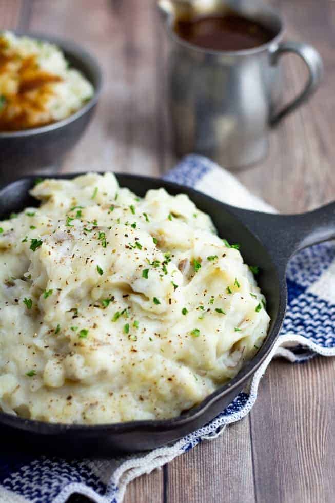 mashed potatoes in black pan on wooden table