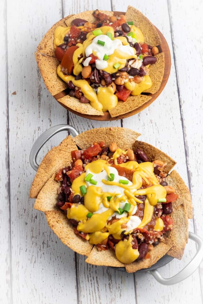 dairy free nachos overhead two bowls on white background