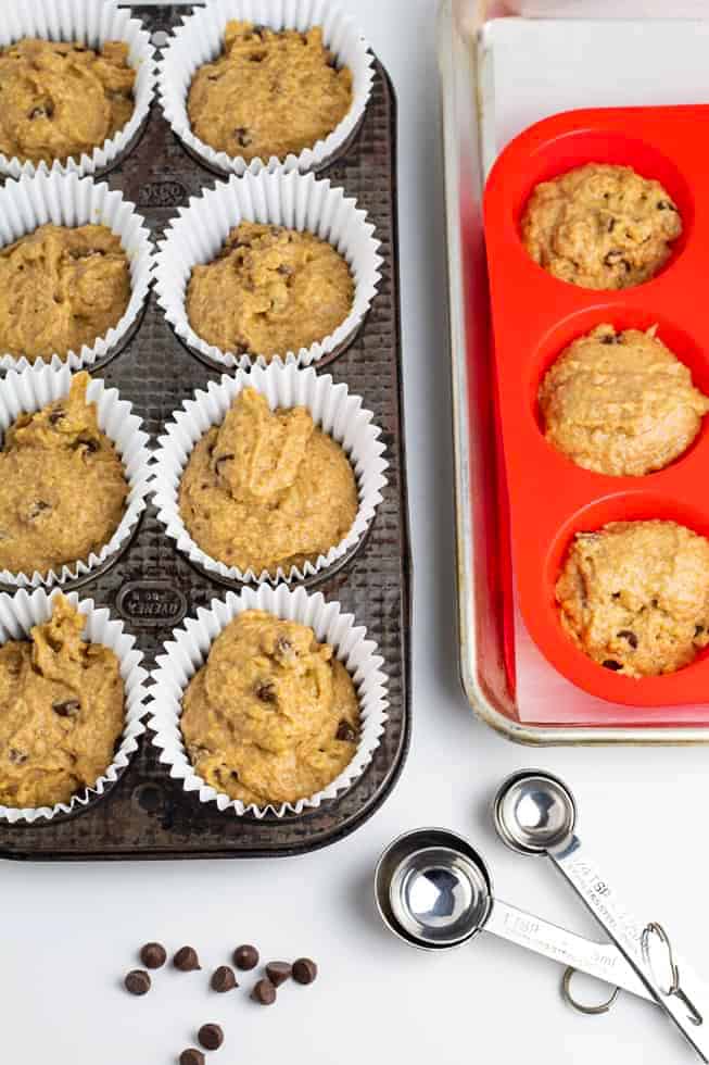 vegan muffins in pan before baking with measuring spoons on table