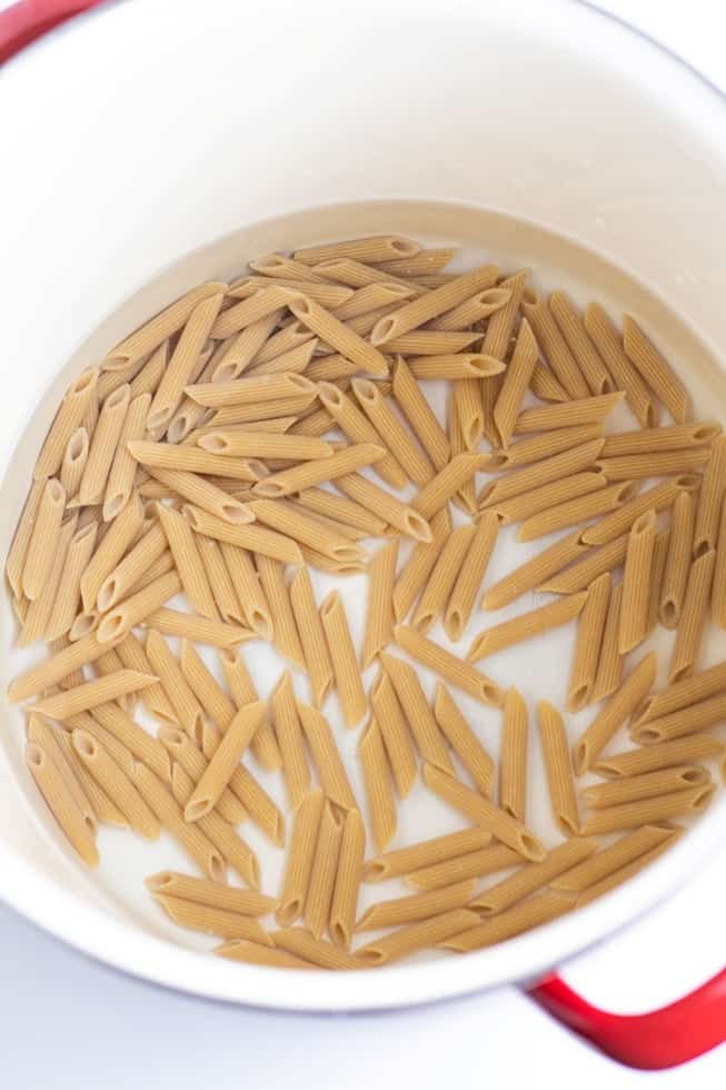 whole wheat penne pasta in pot of water