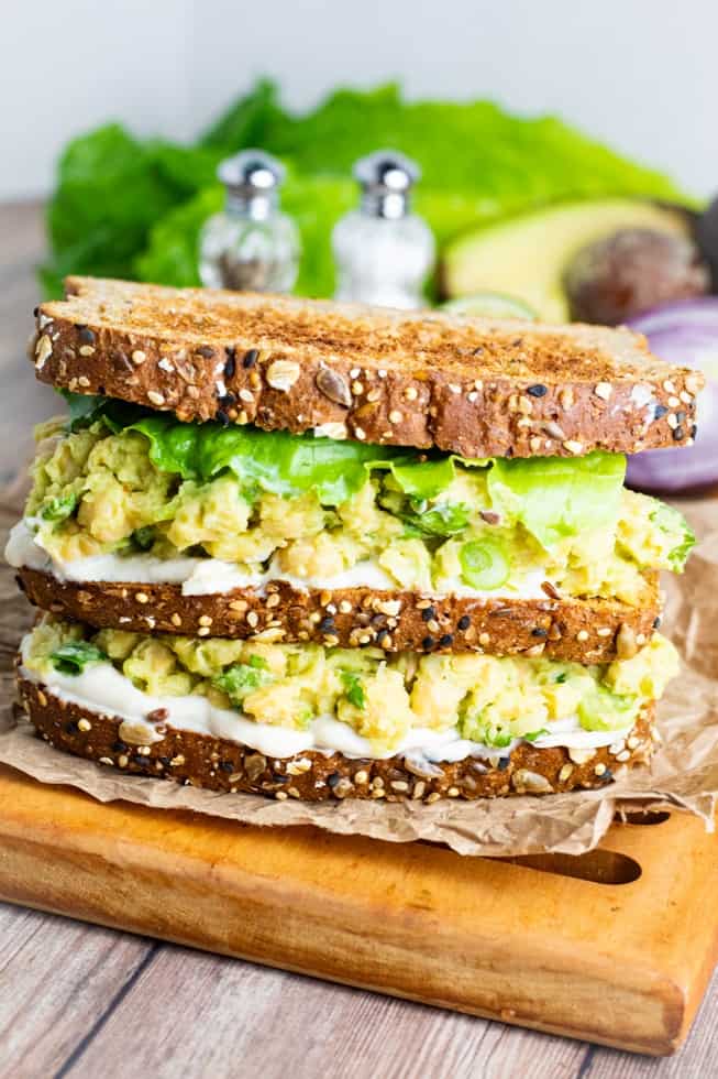 Chickpea Avocado Salad sandwich stacked on cutting board