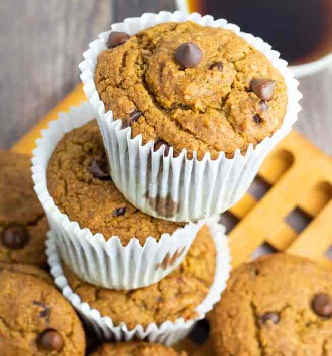 dairy free chocolate chip muffins in white paper cups stacked up