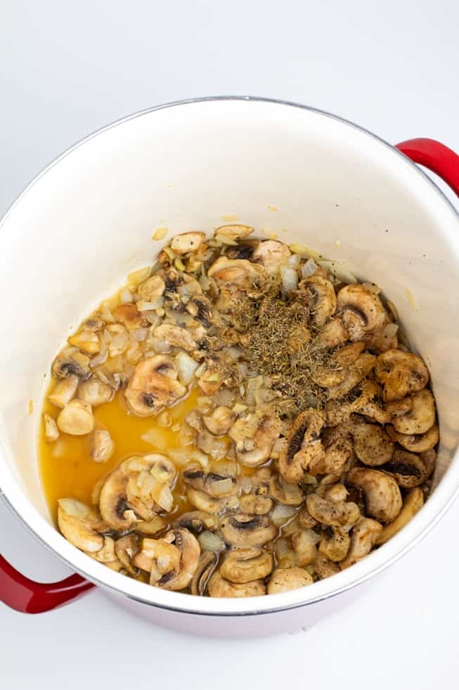 mushrooms onions and garlic in stockpot