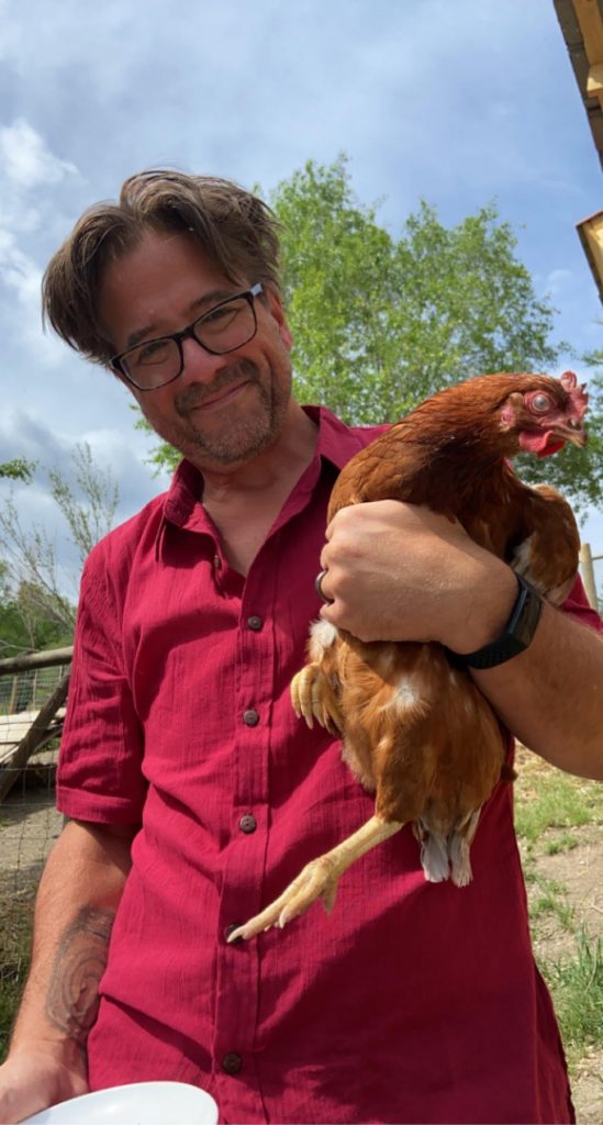craig melton holding a chicken