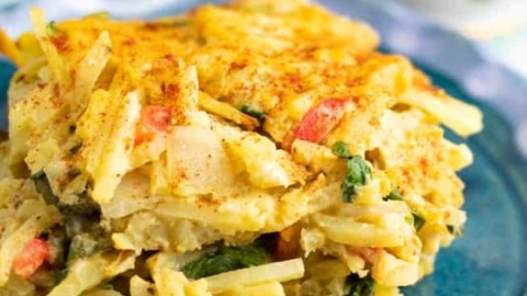 hash brown breakfast casserole on blue plate close up