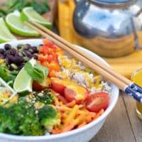 veggie bowl with rice and tahini sauce and chopsticks