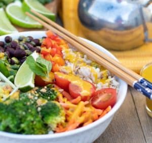 veggie bowl with rice and tahini sauce and chopsticks