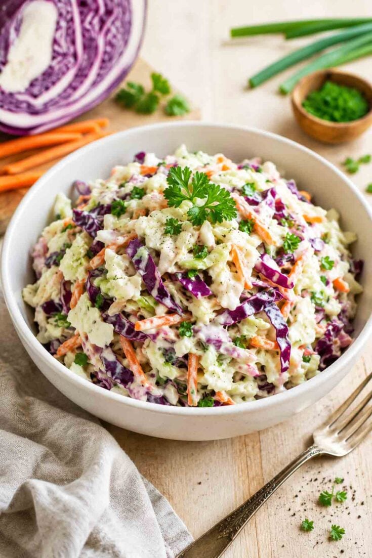 creamy coleslaw in white bowl.