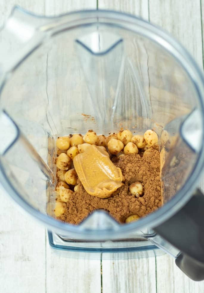 chickpeas, cocoa, maple syrup, peanut butter in vitamix