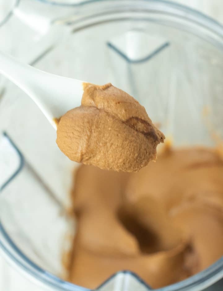 spoonful of chocolate hummus over blender