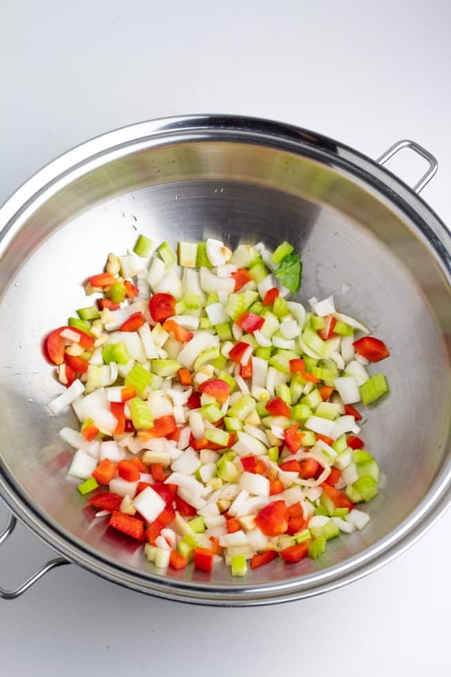 diced celerly, onion, garlic, red bell pepper in stainless pan