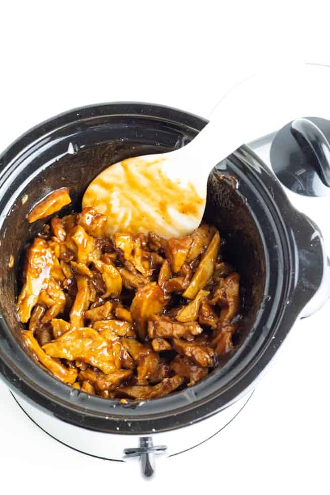 overhead of crockpot full of vegan bbq with white spoon