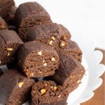 chunks of homemade vegan chocolate on white plate