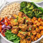 plant-based grain and rice bowl topped with air fryer tofu.
