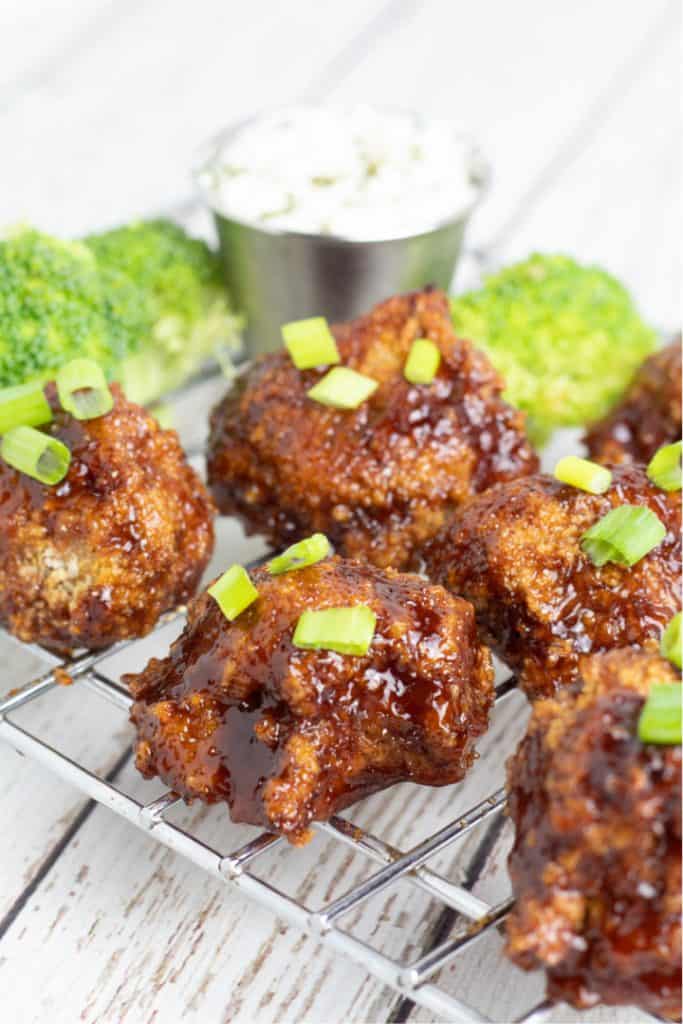 cauliflower wings with bbq sauce on cooling rack