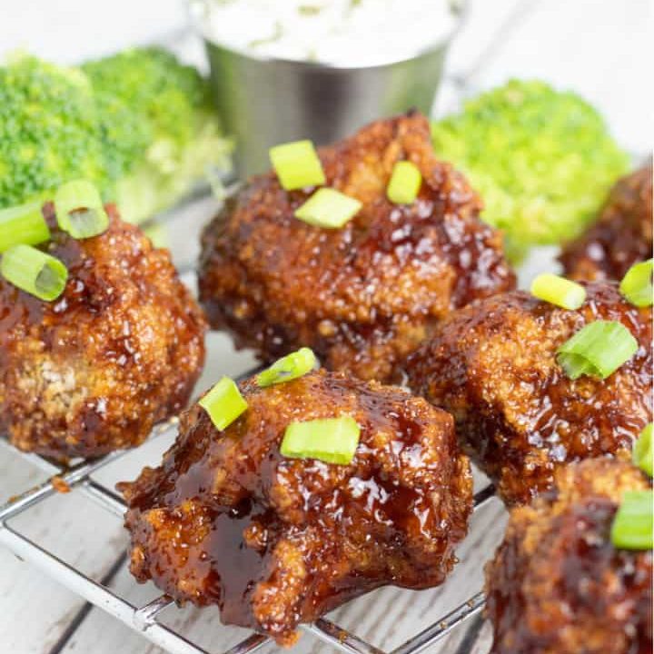 cauliflower wings with bbq sauce on cooling rack