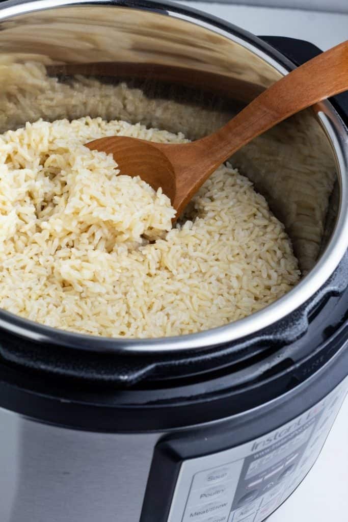 brown rice cooked in instant pot with wooden spoon