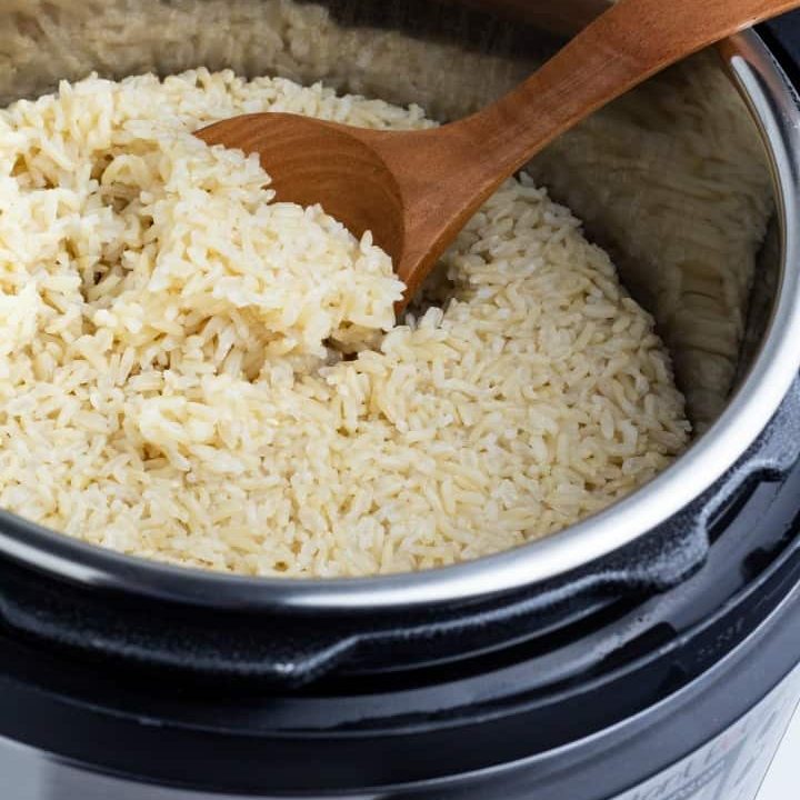 brown rice cooked in instant pot with wooden spoon
