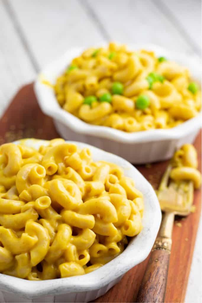 vegan mac and cheese in white bowls
