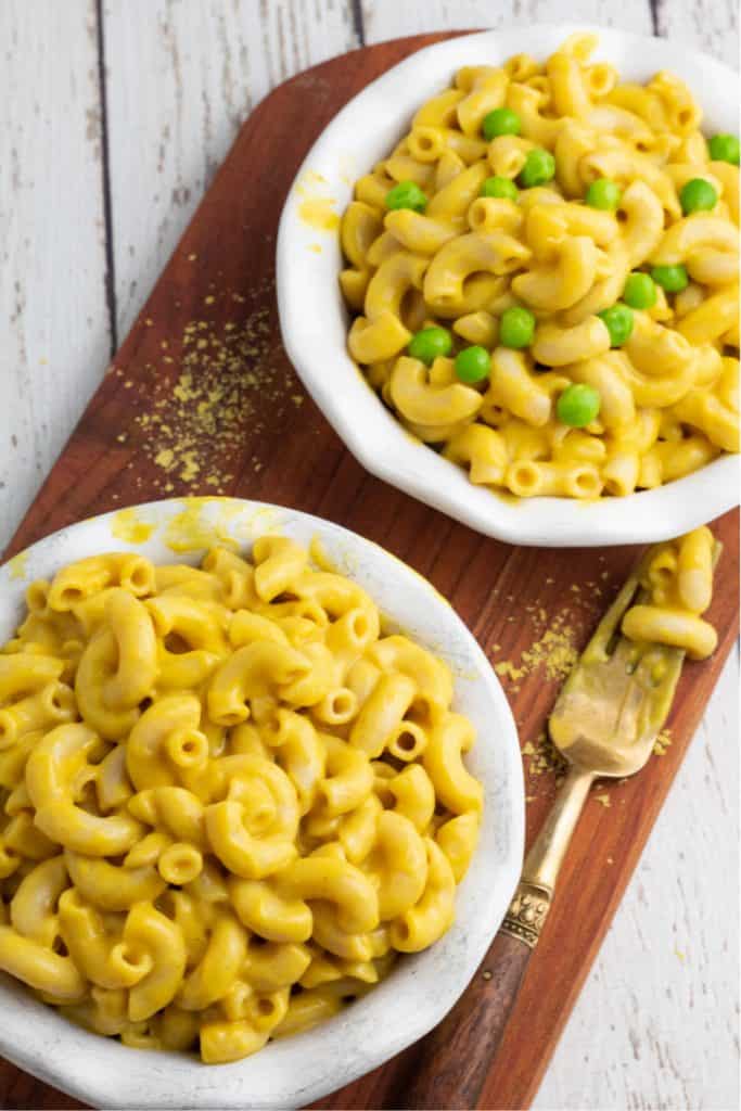 overhead of vegan macaroni and cheese in white bowls