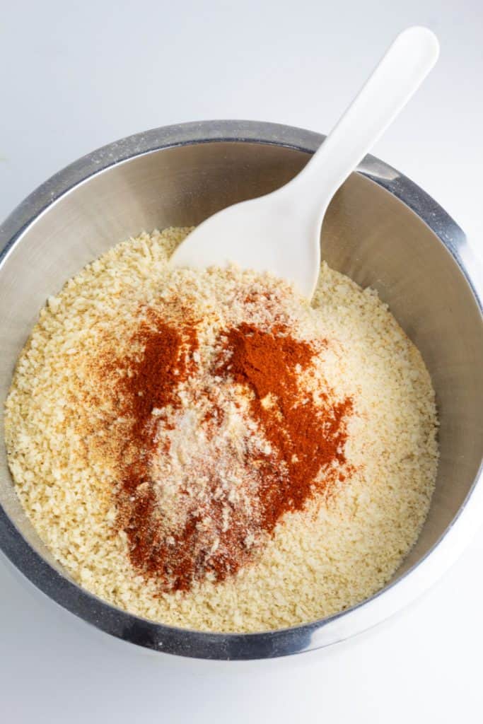flour, bread crumbs, and spices in stainless bowl