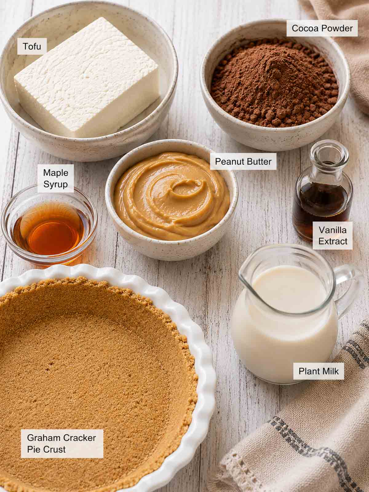 ingredients for tofu chocolate mousse labled on  countertop.