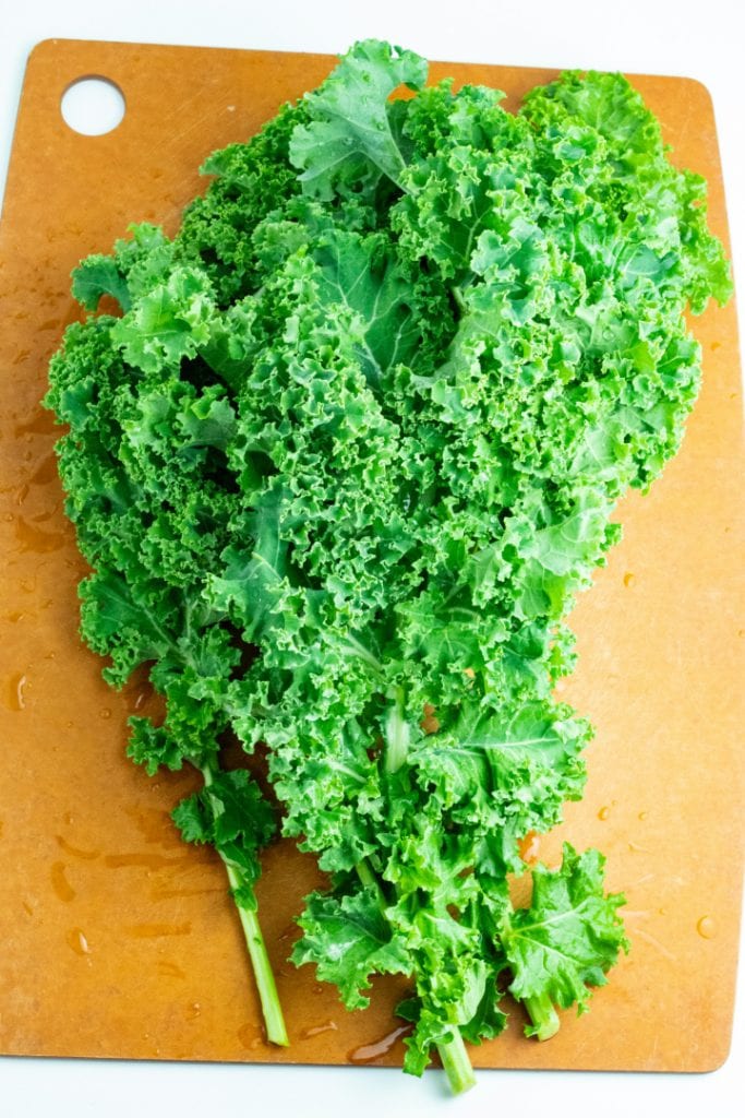 raw kale on cutting board
