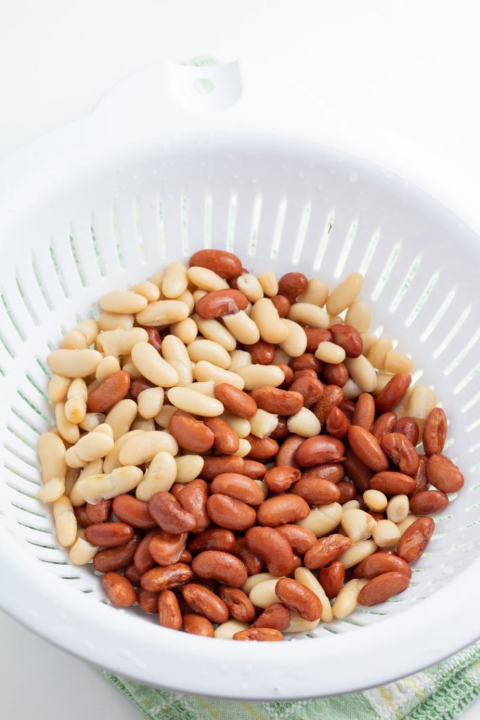 red and white kidney beans in white colander