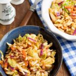 red slaw in blue bowl on wood table