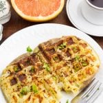 waffle potato cooked in white plate with fork