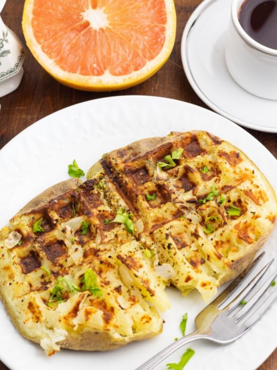 waffle potato cooked in white plate with fork