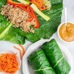 overhead photo of 2 whole vegan wraps made with collard leaves